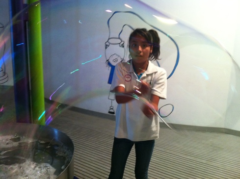 Playing with the big bubbles at the children's museum 